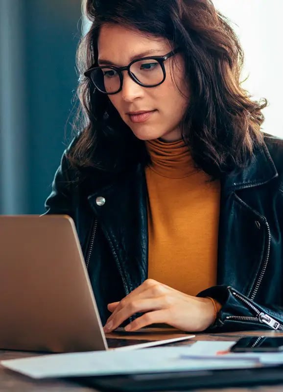 Girl Submitting a Claim in the computer