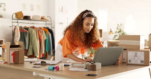 Woman running small online shop from home