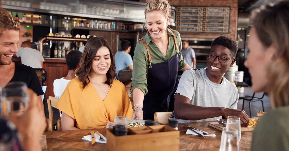 Waitress serving food at a restaurant